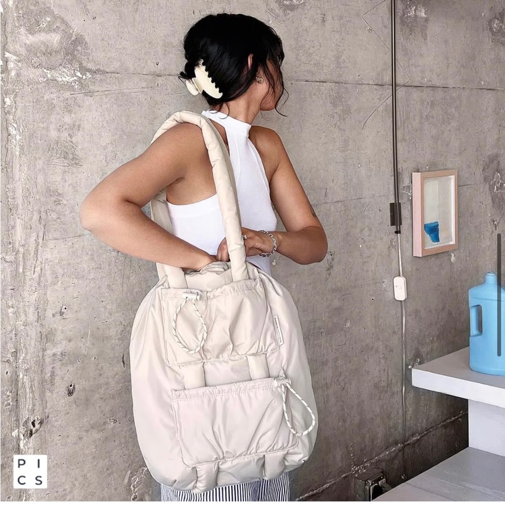 Dagne Dover Kal Drawstring Tote in Moonbeam — milky cream color. Brand new.
